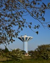 Majestic blue and white water tower blends into the blue sky of northern France