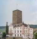 Majestic Boosenburg Tower Overlooking a Historic Mansion in Rudesheim, Germany on a Cloudy Summer\'s Day Royalty Free Stock Photo