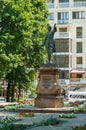 Majestic bronze statue of Russian emperor Peter I on pedestal of pink Pavlovsk granite at Petrovsky Square.