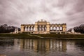 Majestic building situated on the shore of a lake, highlighted by columns along the top: Vienna