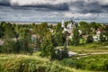 The majestic church is located on the shore of the White Lake and among the green trees