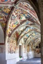 Majestic cloister with medieval frescoes in Brixen dome, South Tyrol, Italy Royalty Free Stock Photo