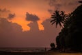 Majestic clouds and orange sky at sunset over the Indian ocean