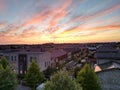 Majestic cloudscape at sunset over city skyline with residential buildings