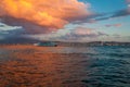 Majestic colorful cloud landscape over the sea and city at sunset. Izmir, Turkey