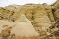 Majestic colorful rock formations in Cappadocia valley. The landscape is a popular tourist attraction