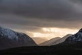 Majestic dramatic Winter sunset sunbeams over landscape of Lost Valley in Etive Mor in Scottish Highlands Royalty Free Stock Photo