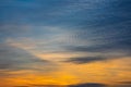 Majestic dusk. Beautiful dark blue sky with vivid golden shades. Dense clouds in twilight orange sky. Cloudy bright sky Royalty Free Stock Photo