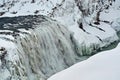 Majestic frozen waterfall with icy cliffs and snow-covered rocks, showcasing nature\'s winter beauty. Royalty Free Stock Photo