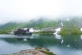 Majestic hose in fog, lake in mountains of Balea glacier lake near the Transfagarasan road. Location: Ridge Fagaras, Sibiu County Royalty Free Stock Photo