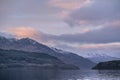 Majestic landscape image across Loch Lomond looking towards snow capped Ben Lui mountain peak in Scottish Highlands Royalty Free Stock Photo