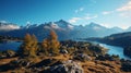 Majestic landscape of rocky mountains with coniferous trees against blue sky in at sunset in switzerland in autumn