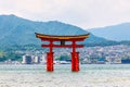 Majestic landscape view of the red Torii gate floating in the water in Miyajima, Hiroshima, Japan. Royalty Free Stock Photo