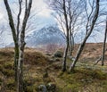 Majestic landscape Winter portrait ofn Stob Dearg Buachaille Etive Mor mountain and snowcapped peak in Scottish Highlands Royalty Free Stock Photo