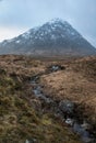 Majestic landscape Winter portrait ofn Stob Dearg Buachaille Etive Mor mountain and snowcapped peak in Scottish Highlands Royalty Free Stock Photo
