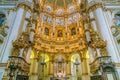 Majestic main altar in `Our Lady of the Assumption` Cathedral in Granada. Andalusia, Spain.