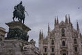 Majestic marble statue standing in front of the Duomo di Milano grand Cathedral