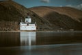 a castle on top of a small island on a lake Royalty Free Stock Photo