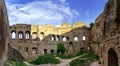 Majestic medieval castle ruins on the top of the hill Royalty Free Stock Photo