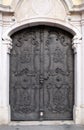 Majestic medieval door with ornate metal pattern and stone columns in Salzburg