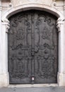 Majestic medieval door with ornate metal pattern and stone columns in Salzburg