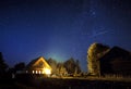 majestic milky Way and the shooting star above the village house in summer. A starry night sky Royalty Free Stock Photo