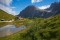 Majestic morning scene of Baita Segantini mountain refuge with Cimon della Pala peak. Summer view of Dolomiti Alps Royalty Free Stock Photo