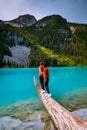 Majestic mountain lake in Canada. Upper Joffre Lake Trail View, couple visit Joffre Lakes Provincial Park - Middle Lake