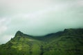 Majestic mountain with lush green foliage rises high into the sky, Iceland Royalty Free Stock Photo