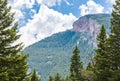 Majestic mountain peak and sloping hillside covered with lush forest near Bozeman, Montana Royalty Free Stock Photo