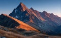 Majestic Mountain Peak at Sunset with Golden Slopes Royalty Free Stock Photo