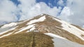 Majestic Mountain Peaks covered with Snow and soaring blue skies