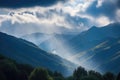 majestic mountain range, with misty clouds and sunshine, against blue sky Royalty Free Stock Photo