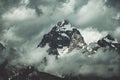 Majestic mountain range set against a grey, cloudy sky Royalty Free Stock Photo