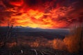 majestic mountain range surrounded by fiery sunsets, with clouds and trees in the foreground