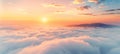 Majestic mountain sunrise with clouds, fog, and orange sky in a stunning morning landscape view