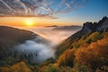 majestic mountain sunrise over misty valley