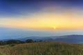 Majestic mountain sunset and colored sky with clouds