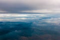 Majestic Mountains: A Mysterious Aerial View of Clouds and Peaks