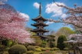 majestic pagoda amidst lush gardens in springtime, with cherry blossoms in full bloom