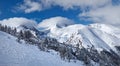 Majestic Pirin mountains peaks covered with snow. Winter panorama at Bansko ski resort in Bulgaria Royalty Free Stock Photo