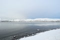 Majestic prestine white snow on sea shore and mountain Royalty Free Stock Photo