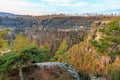 Majestic sandstone cliffs and verdant forest in autumn landscape Royalty Free Stock Photo