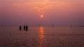 Silhouette of peoples at Bagan Lalang Beach during the sunset in the evening Royalty Free Stock Photo