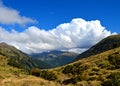 Majestic shot of a heavily clouded sky over a forested mountain range Royalty Free Stock Photo