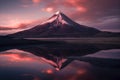 a majestic snow-capped mountain reflected in a tranquil lake under a vibrant pink and purple sunset sky Royalty Free Stock Photo