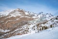 Majestic snow covered mountain range against blue sky in alps Royalty Free Stock Photo