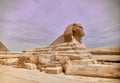 Majestic sphinx sculpture stands guard in front of the iconic pyramids of Giza, Egypt.