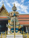 Majestic stone figure of a demon guardian in the grand palace of Wat Phra Kaew in Bangkok, Thailand