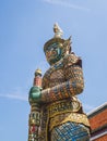 Majestic stone figure of a demon guardian in the grand palace of Wat Phra Kaew in Bangkok, Thailand